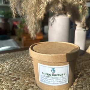 This image is of a brown paper tub with A bone broth based soup for dogs with Spinach and healing spices.